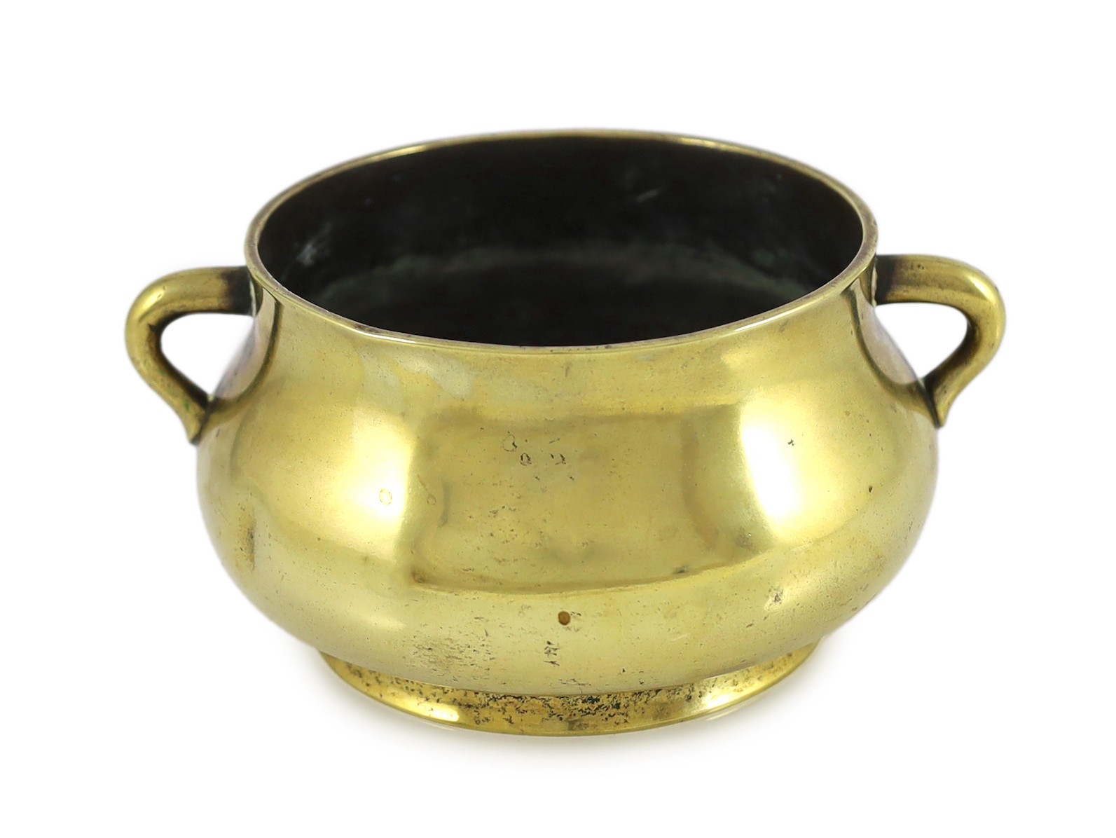 A Chinese polished bronze censer, gui, Xuande six character mark, 18th/19th century, 19cm wide, dented, solder repair